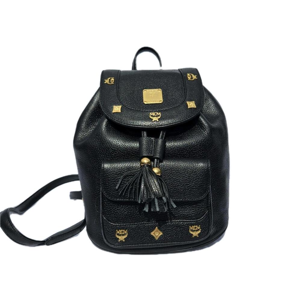 MCM Black Leather Backpack with gold studs.